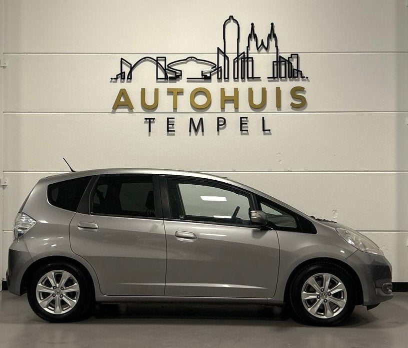 Honda Jazz 1.4 Hybrid Exclusive Automaat Nap 1E Eigenaar Dea, Auto's, Euro 5, Gebruikt, Zwart, 4 cilinders