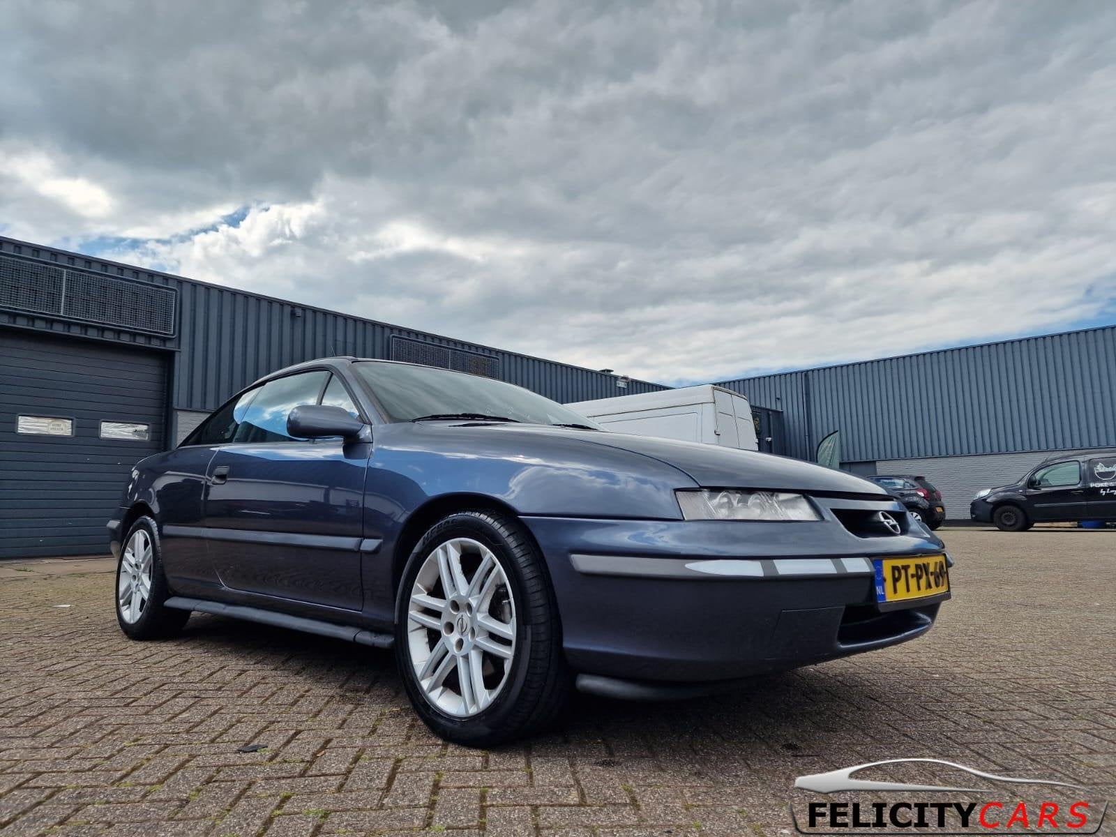 Opel Calibra 2.5i V6 Leer airco aut '96 met taxatie, Auto's, Oldtimers, 2498 cc, Bedrijf, Opel, 170 pk