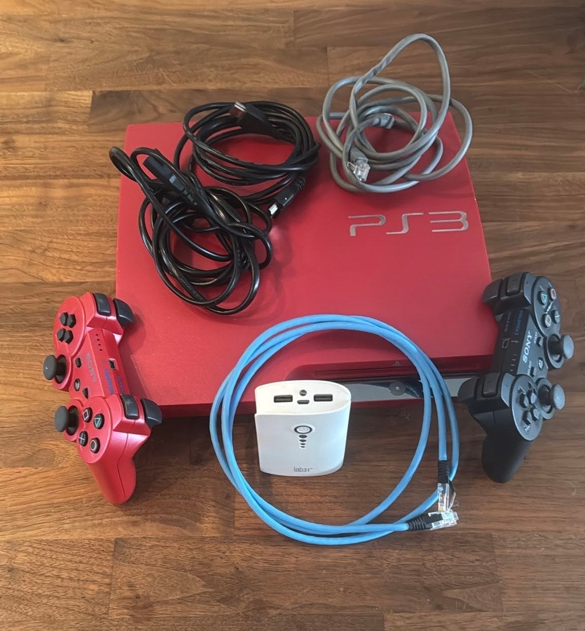 Rode PlayStation 3 Slim met 2 controllers Limited Edition, Spelcomputers en Games, Gebruikt, Met 2 controllers, Ophalen of Verzenden