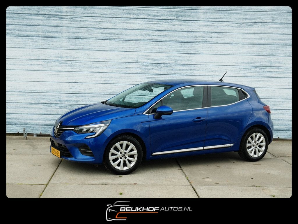 Renault Clio 1.0 TCe Intens Airco Cruise Control Carplay, Auto's, Voorwielaandrijving, Gebruikt, Blauw, Leder en Stof
