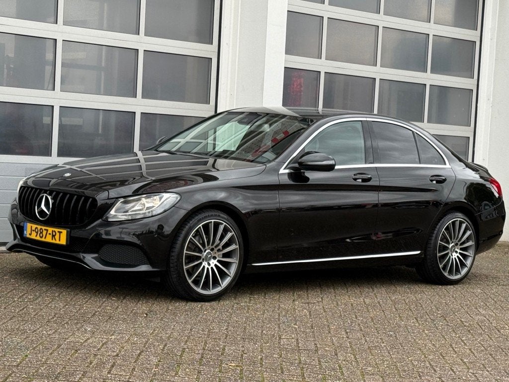 Mercedes-benz C-KLASSE C180 Prestige AMG Navi Pdc Leer Stoel, Auto's, Euro 6, 4 cilinders, 157 pk, Zwart