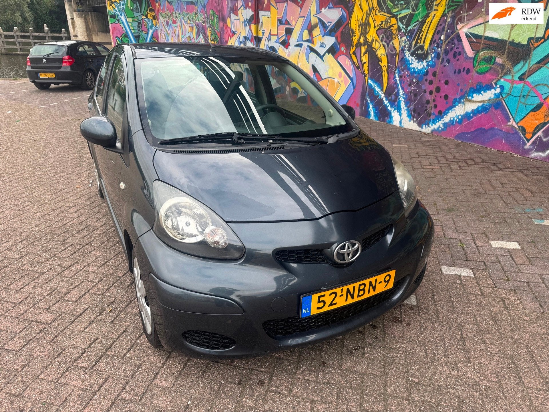 Toyota Aygo 1.0-12V Comfort airco 5 deuren apk november 140, Voorwielaandrijving, Stof, Gebruikt, Zwart