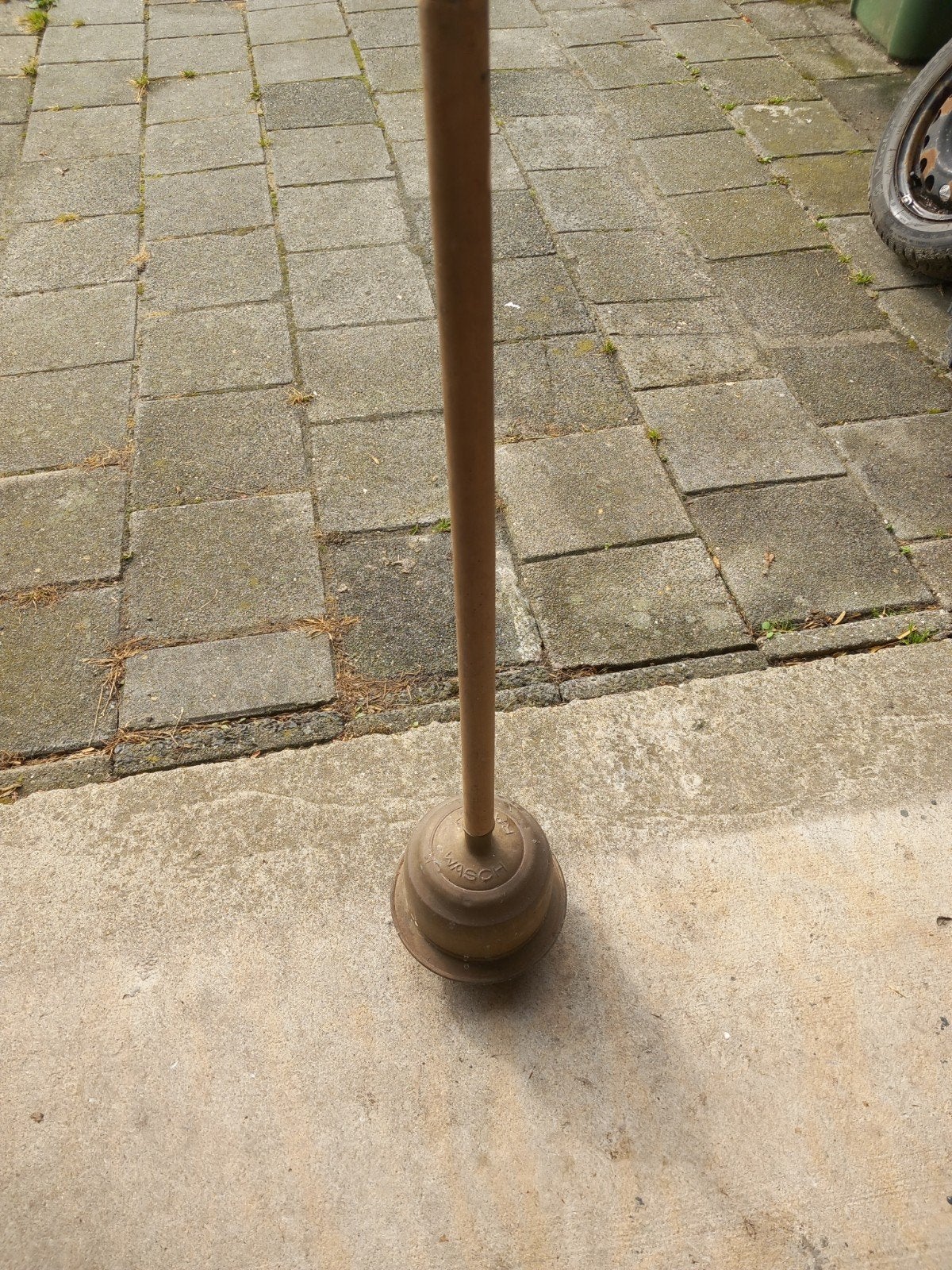 Koperen wasstamper, Ophalen