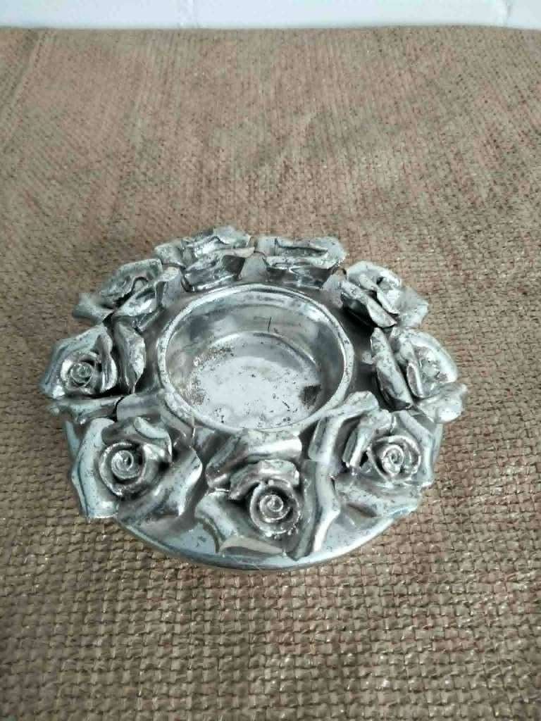 Kaarsenhouder met rozen, Ophalen