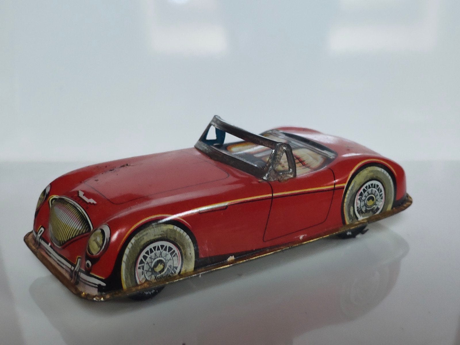 Joustra (?) Austin Healey van blik, Antiek en Kunst, Antiek | Speelgoed, Ophalen of Verzenden