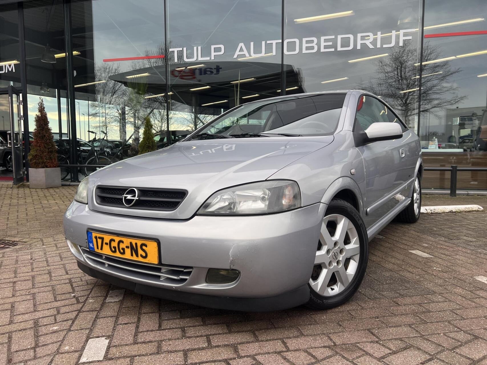 Opel Astra Coupé 1.8-16V Airco Lage km stand NAP, Auto's, Opel, 1160 kg, Stof, Zwart, 4 cilinders