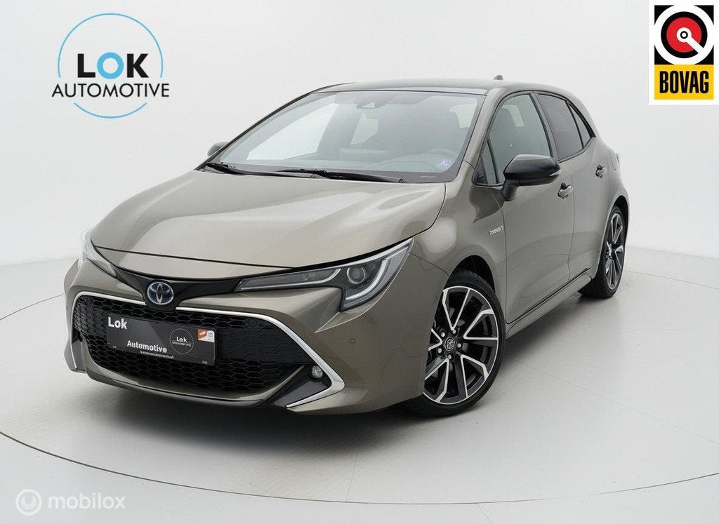 Toyota Corolla 2.0 Hybrid Executive JBL HUD|CAMERA|JBL|ACC|, Auto's, Gebruikt, Zwart, 4 cilinders, Bruin