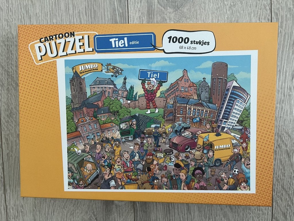 Cartoon puzzel Tiel editie - (Jumbo) -  1000 stukjes, Ophalen of Verzenden, 500 t/m 1500 stukjes, Zo goed als nieuw, Legpuzzel