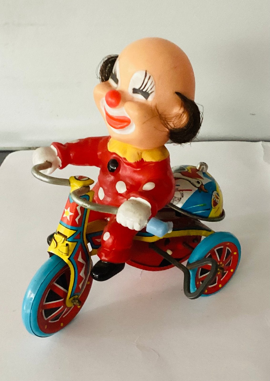 Oud 1960’s Opwindbaar blikken clowntje op fiets,Suzuki,Japan, Antiek en Kunst, Ophalen