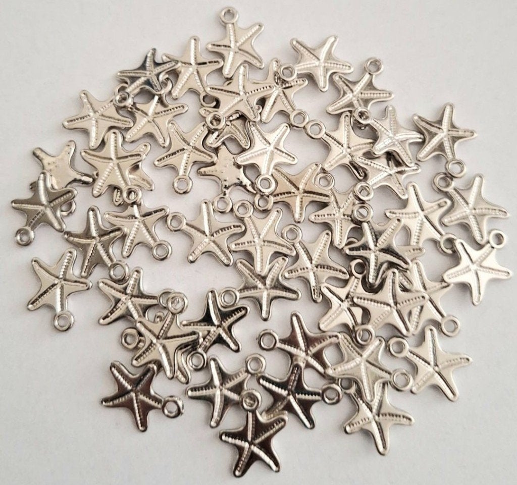 Partij 50 zilverkleur zeester bedels 17 mm, Verzenden, Nieuw, Bedel
