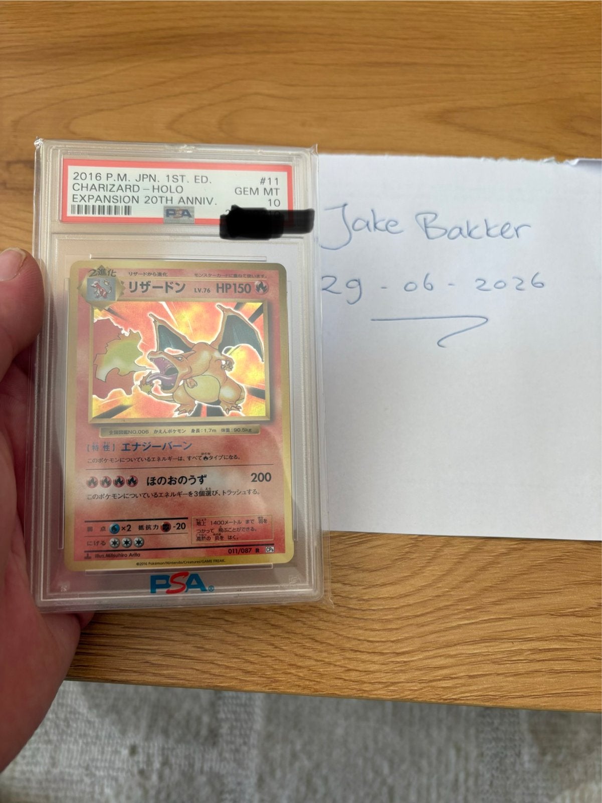 Charizard PSA10 20th Anniversary Holo Japanse 1st Edition, Hobby en Vrije tijd, Verzamelkaartspellen | Pokémon, Nieuw, Losse kaart