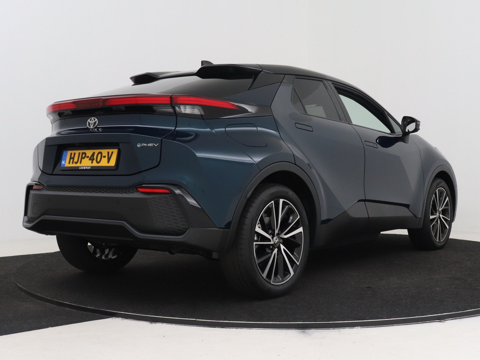 Toyota C-HR 2.0 Plug-in Hybrid 220 Executive | NL dealeronde, Auto's, 12 maanden, 4 cilinders, Blauw, Leder en Stof