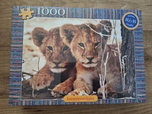 Puzzel Leeuwenwelpjes 1000 stukjes Nieuw in verpakking, Ophalen of Verzenden, 500 t/m 1500 stukjes, Nieuw, Legpuzzel