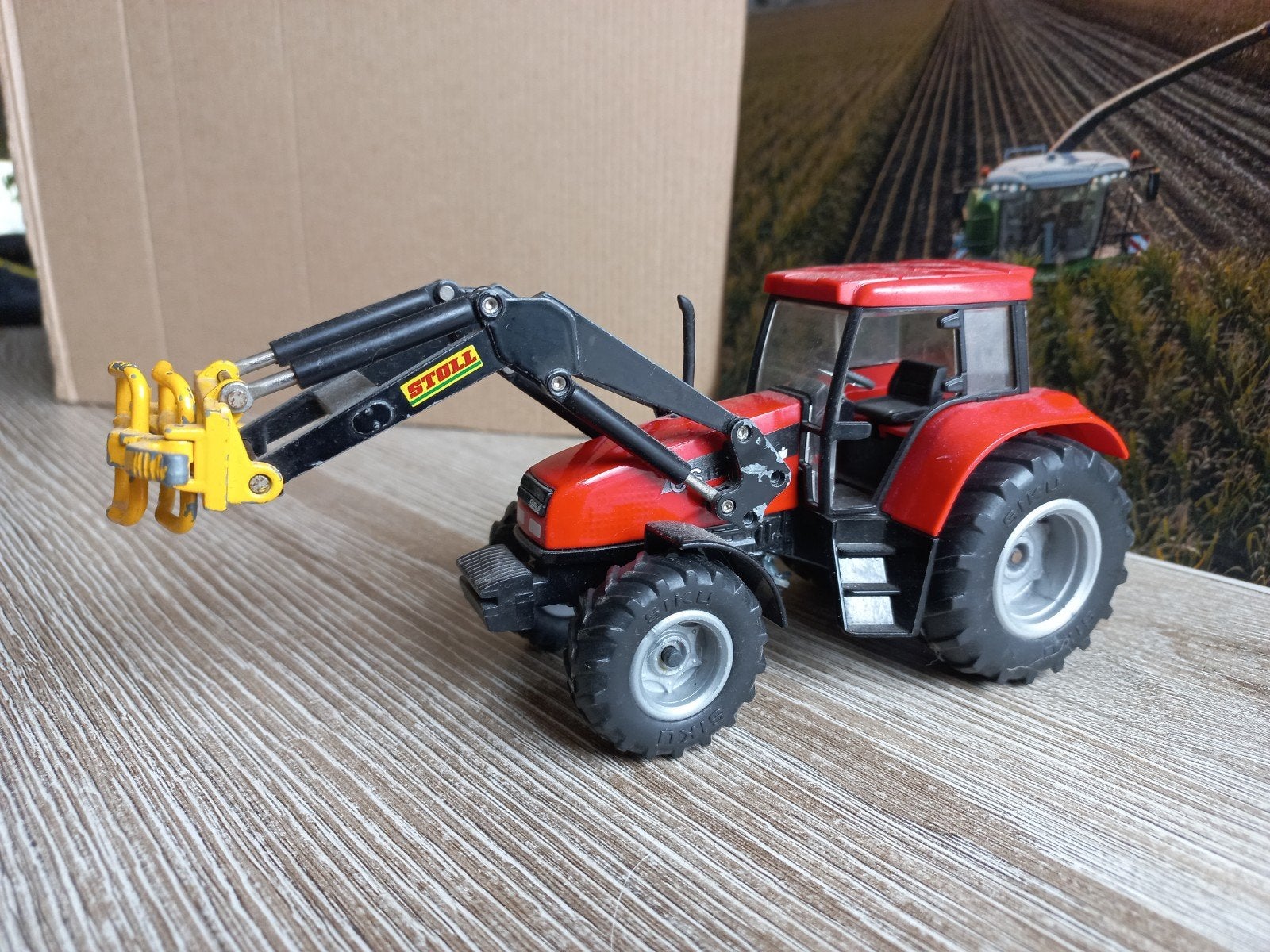 Case Cs 150 met Voorlader Stoll Balenklem Siku, Hobby en Vrije tijd, Modelauto's | 1:32, Gebruikt, Tractor of Landbouw, SIKU, Ophalen of Verzenden