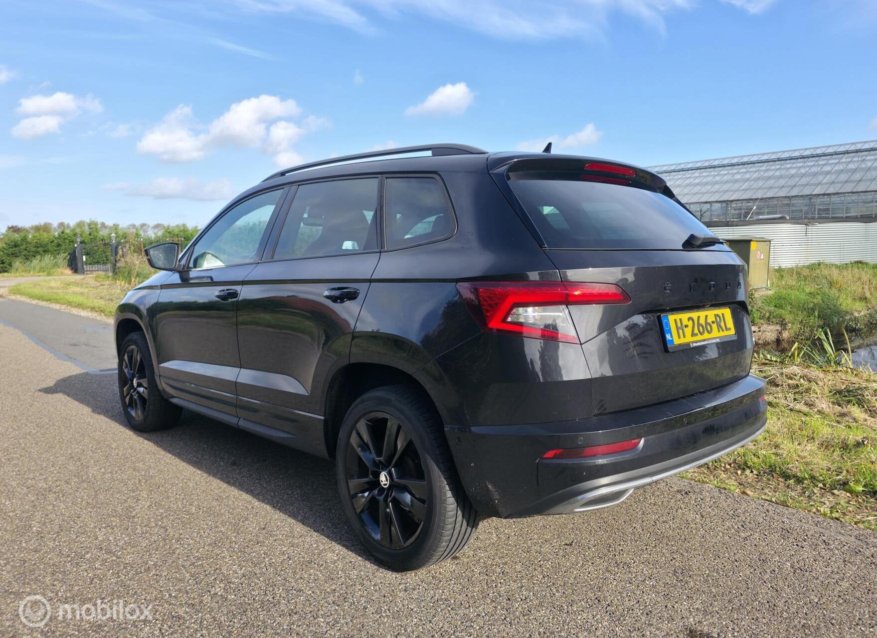 Skoda Karoq 1.5 TSI ACT Sportline / Canton / Leder / Camera, Auto's, 4 cilinders, 150 pk, Zwart, Bedrijf