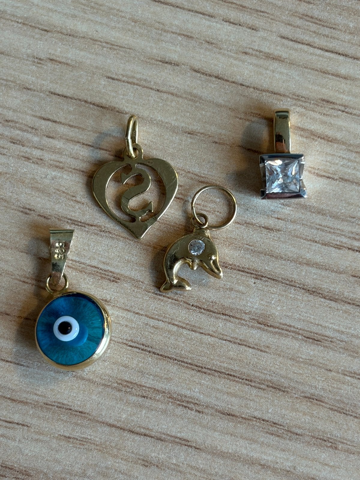 Gouden hangers: hart, dolfijn, boze oog en zirkonia, Gebruikt, Overige voorstellingen, Ophalen of Verzenden, Met edelsteen