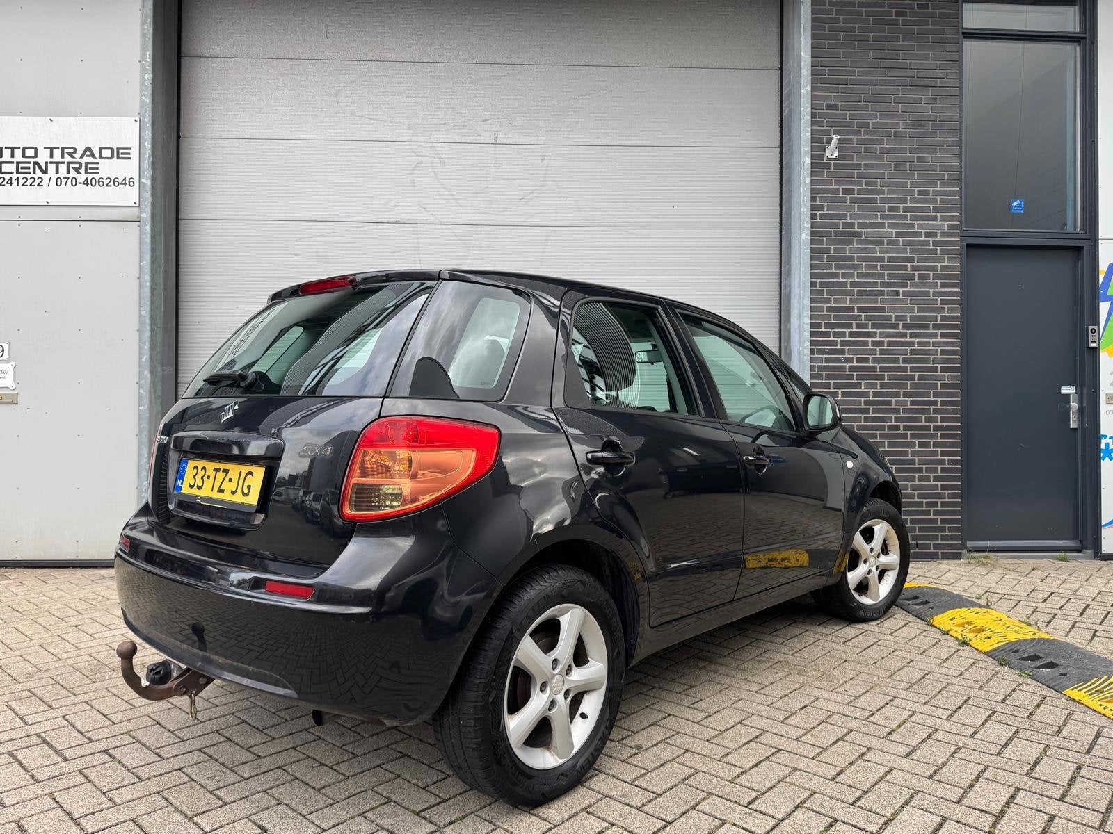 Suzuki SX4 1.6 Comfort [ 1e eig | Airco | Trekhaak | Elek pa, Auto's, Stof, Gebruikt, Zwart, 4 cilinders