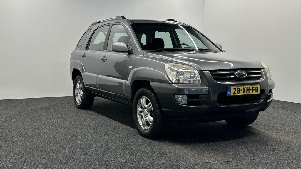 Kia Sportage 2.0 CVVT Comfort AIRCO TREKHAAK CRUISE ., Auto's, Kia, 1442 kg, Stof, Gebruikt, Met garantie (alle)