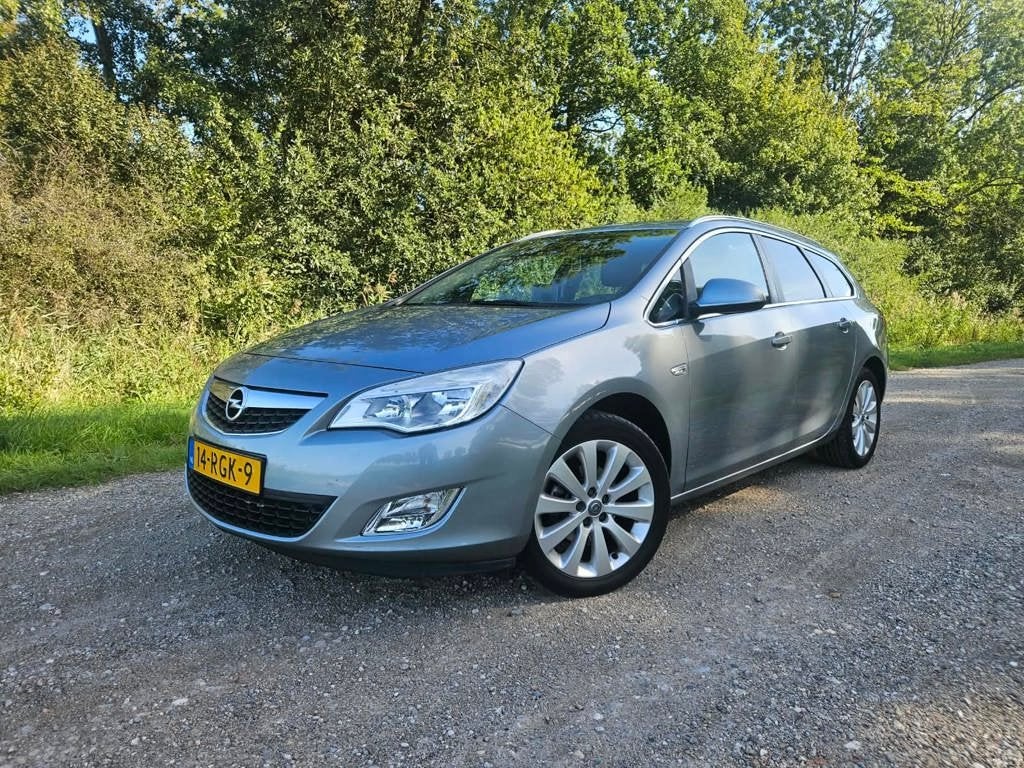 Opel Astra Sports Tourer 1.4 Turbo Cosmo AIRCO I CRUISE, Auto's, Voorwielaandrijving, Euro 5, Gebruikt, Zwart