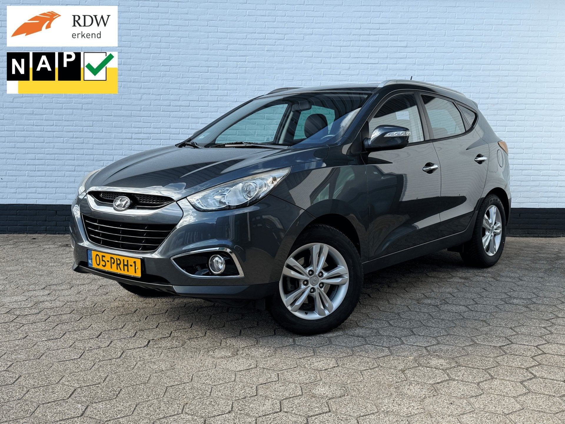 Hyundai Ix35 2.0i Style l CRUISE l CAMERA l TREKHAAK l NAP!, Auto's, Gebruikt, Zwart, 4 cilinders, Leder en Stof