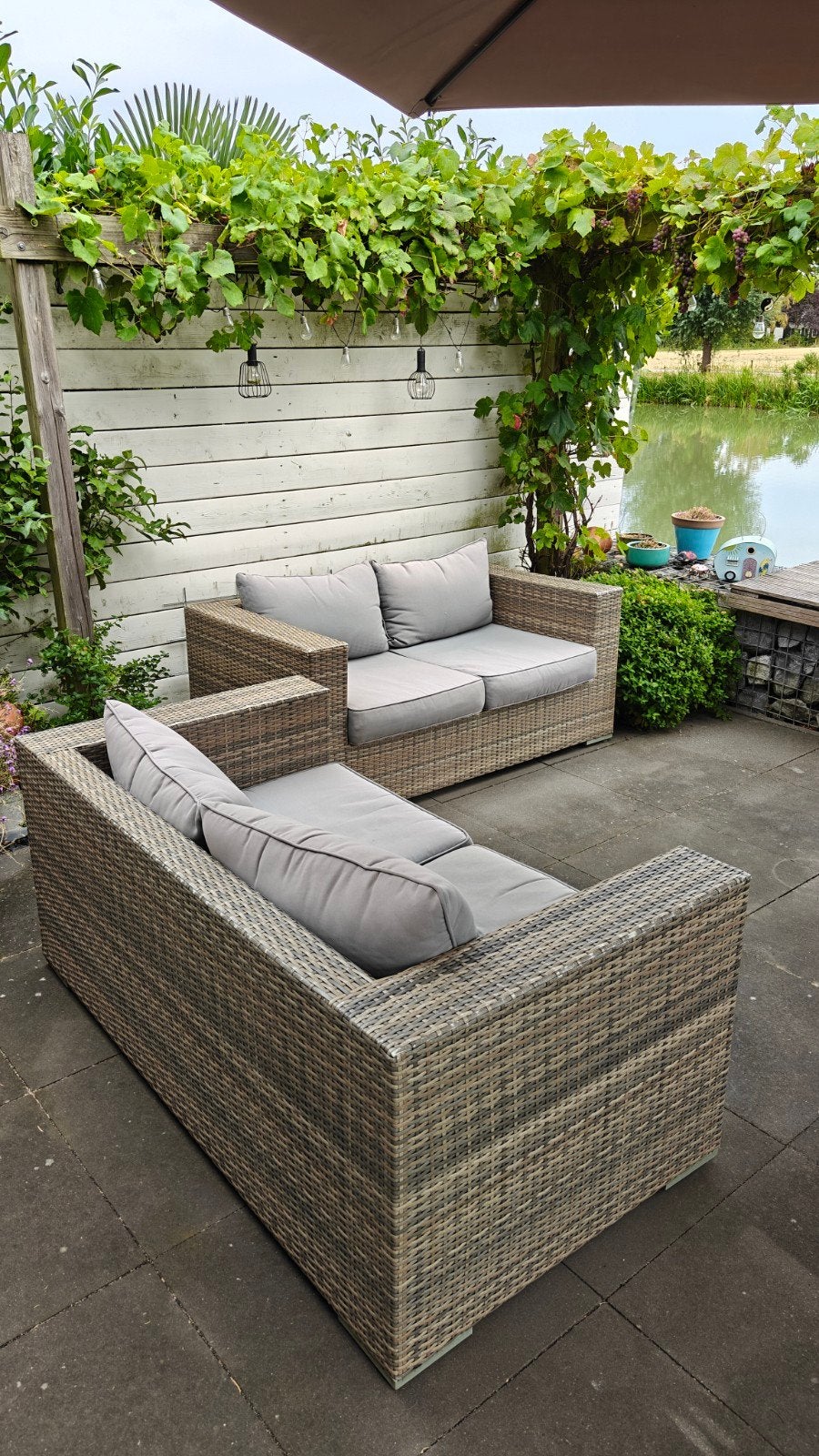 Wicker loungeset bank met kussens en bescherm hoezen, Ophalen, 4 zitplaatsen, Gebruikt, Loungeset