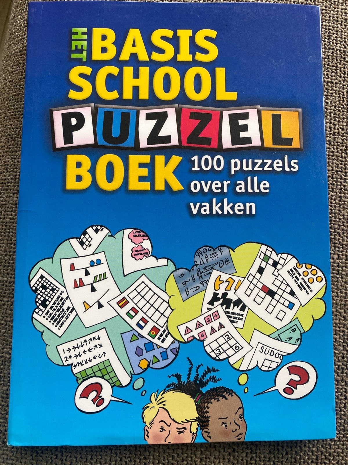 Het Basisschool Puzzelboek - 100 puzzels over alle vakken, Hobby en Vrije tijd, Denksport en Puzzels, Zo goed als nieuw, Puzzelboek