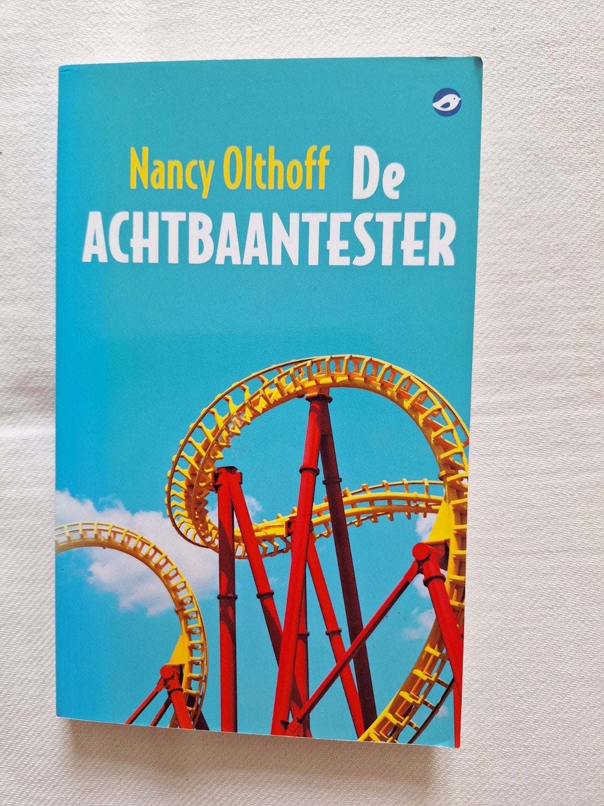 De Achtbaantester van Nancy Olthoff., Ophalen of Verzenden, Zo goed als nieuw