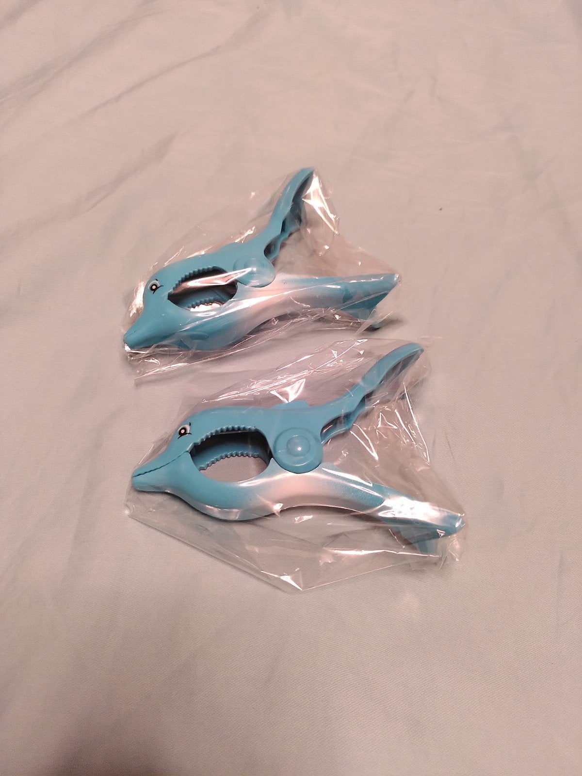 2 dolfijn handdoekknijpers, Ophalen of Verzenden, Nieuw, Blauw, Kunststof