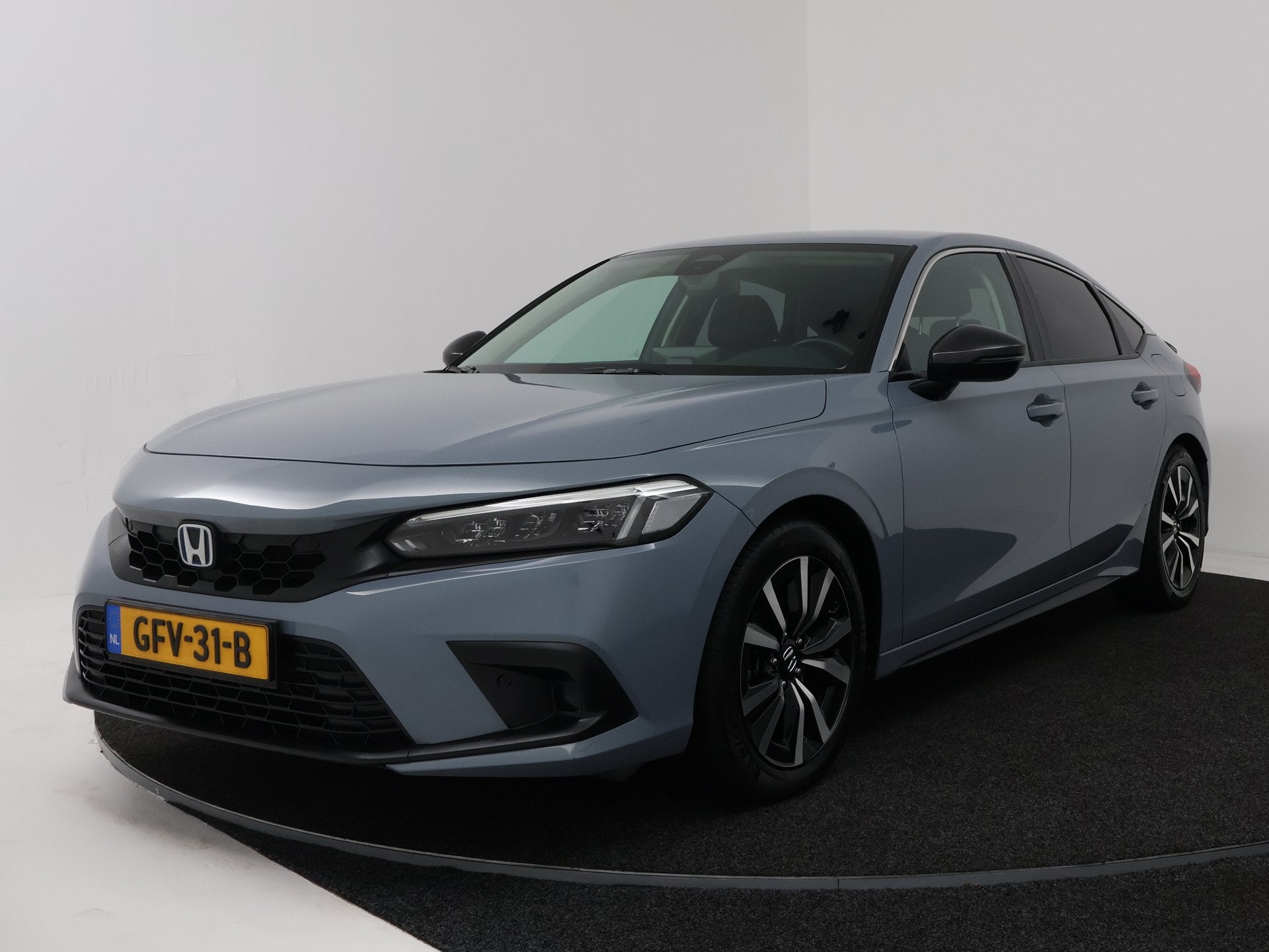 Honda Civic 2.0 e:HEV Elegance (bj 2024, automaat), Stof, Gebruikt, 4 cilinders, Automatische klimaatregeling