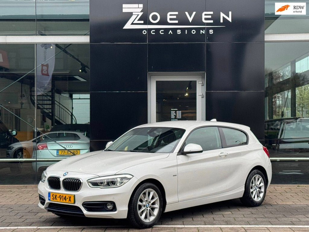BMW 1-serie 118i Centennial High Executive/ Automaat/Navi, Auto's, Gebruikt, 1290 kg, 4 stoelen, Wit