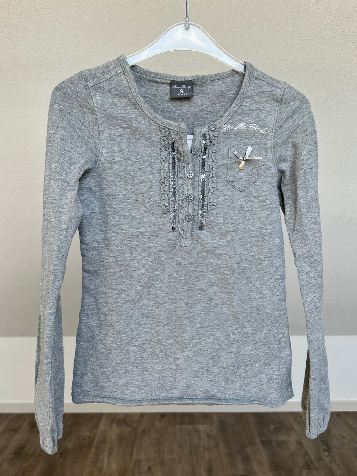 Tricot grijs shirt maat 122/128 baker bridge, Ophalen of Verzenden, Zo goed als nieuw, Meisje, Shirt of Longsleeve