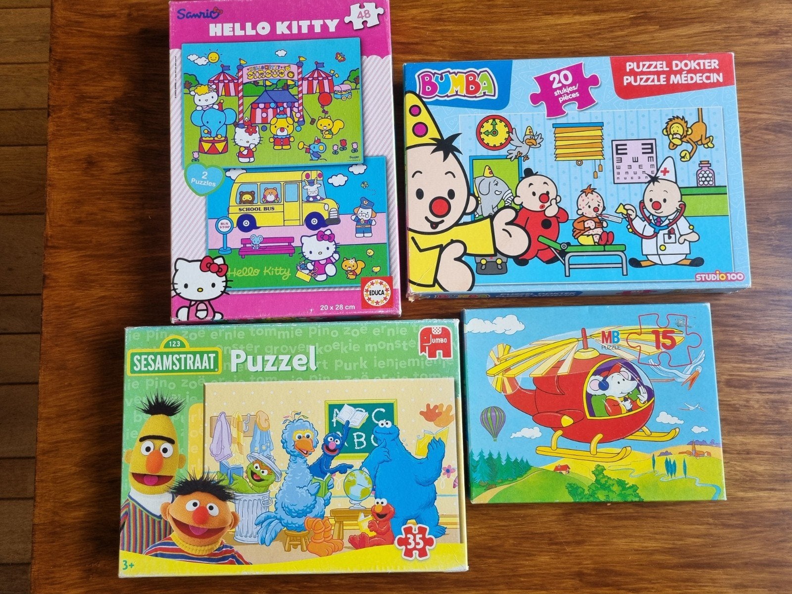 Diverse kinder puzzels, Hello Kitty, Sesamstraat, Ophalen of Verzenden, 10 tot 50 stukjes, Gebruikt, 4 tot 6 jaar
