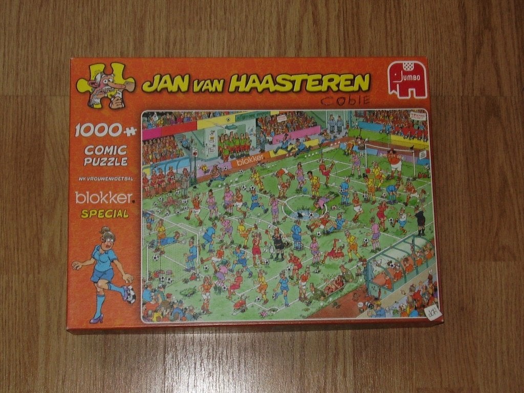 Jan van Haasteren - WK Vrouwenvoetbal Blokker - (1000 stuks), Ophalen of Verzenden, 500 t/m 1500 stukjes, Zo goed als nieuw, Legpuzzel