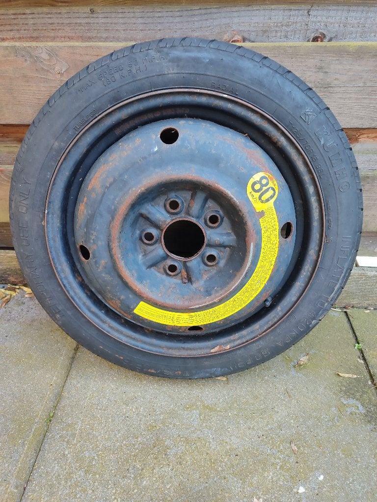 1.	Net Thuiskomer / Reserveband T125/70R16 –, Ophalen, Gebruikt