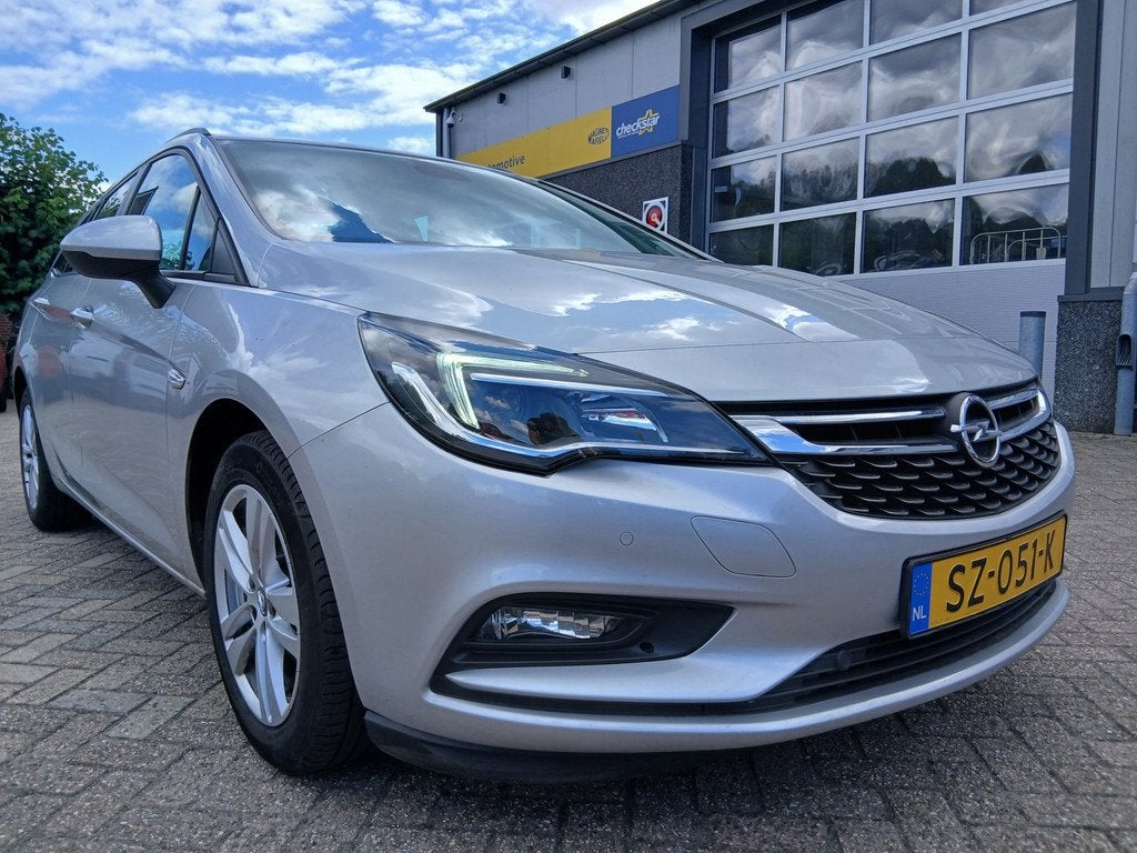 Opel Astra Sports Tourer 1.0 Innovation - Automaat - Trekhaa, Auto's, Stof, Gebruikt, Euro 6, 1178 kg