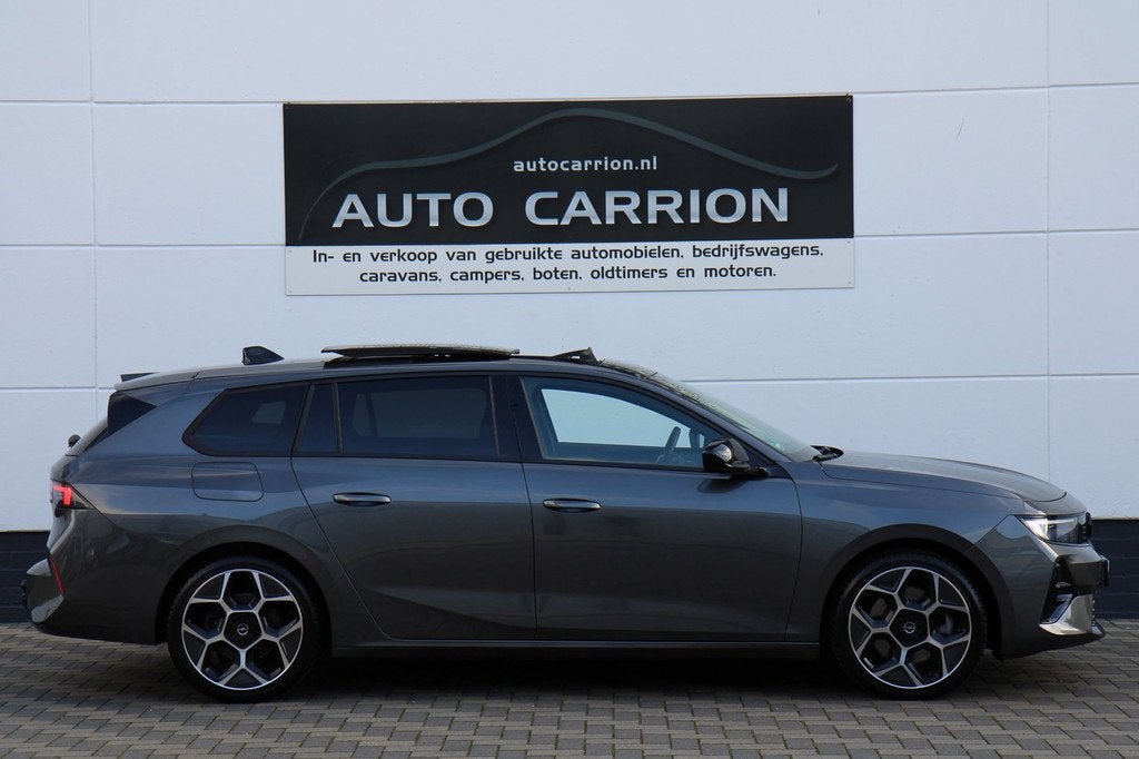 Opel Astra Sports Tourer 1.6 Turbo GS PHEV Pano HUD BTW !, Auto's, Opel, Gebruikt, 4 cilinders, 179 pk, Leder en Stof