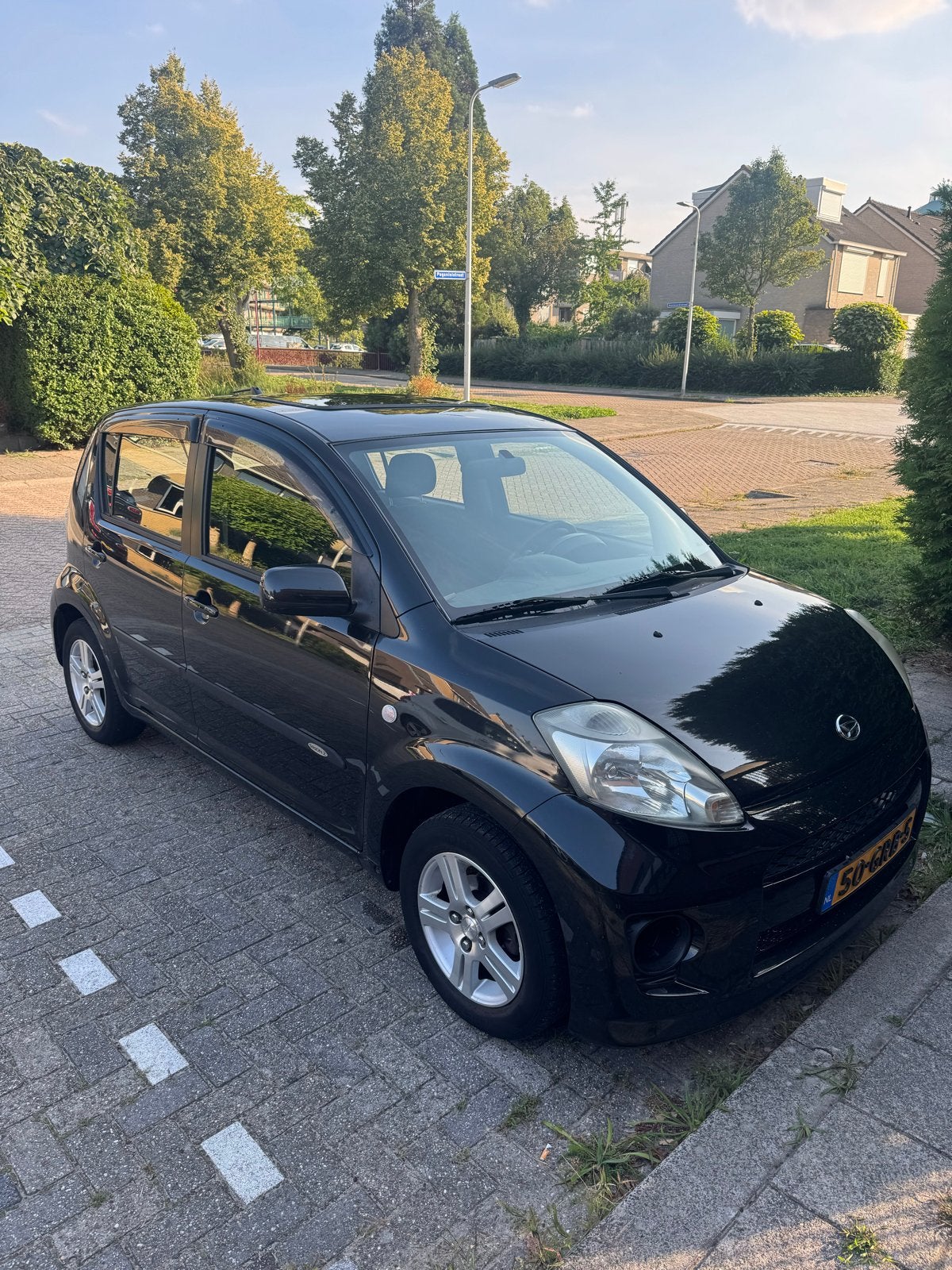Daihatsu Sirion 1.0 51KW 2008 Zwart, Auto's, Voorwielaandrijving, Zwart, Handgeschakeld, 3 cilinders