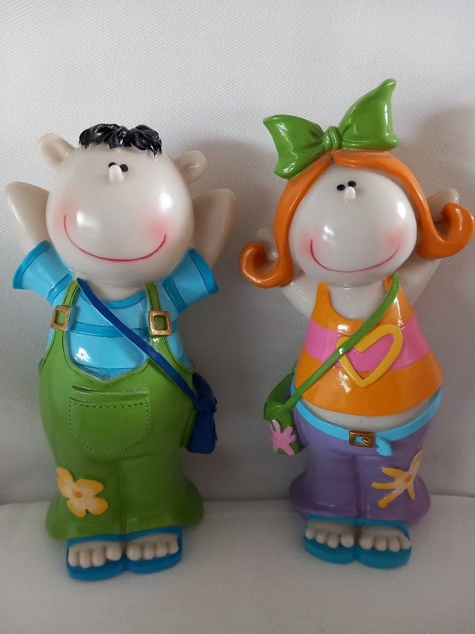 2 Spaarpotten van een jongetje en een meisje., Ophalen of Verzenden, Zo goed als nieuw, Steen, Aardewerk of Keramiek, Overige thema's