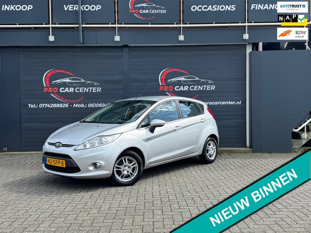 Ford Fiesta 1.25 Titanium CLIMATE|CRUISE|PDC|EL.RAMEN|LMV|NA, Auto's, Ford, Voorwielaandrijving, Euro 5, Stof, 1242 cc