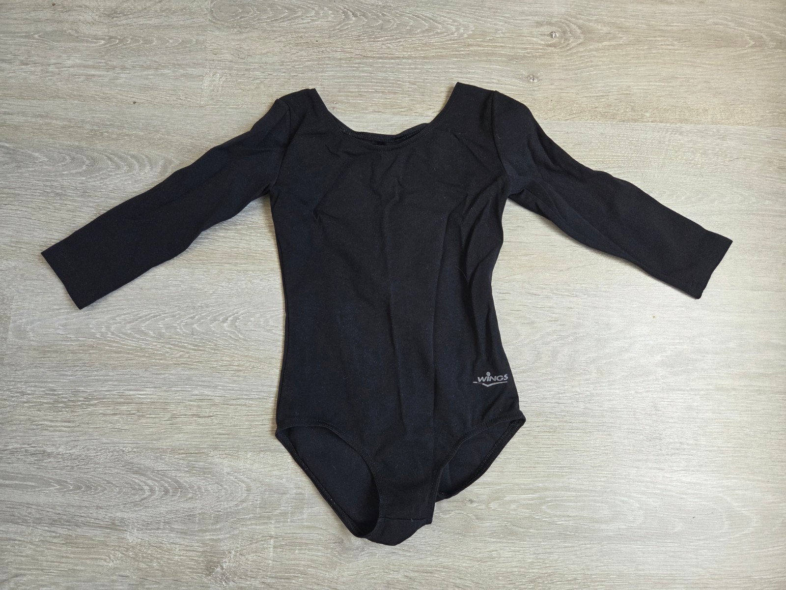 Zwart turnpakje met lange mouwen - Wings, Sport en Fitness, Turnen, Kindermaat 122 t/m 140, Ophalen of Verzenden, Gebruikt, Turnpak(je)