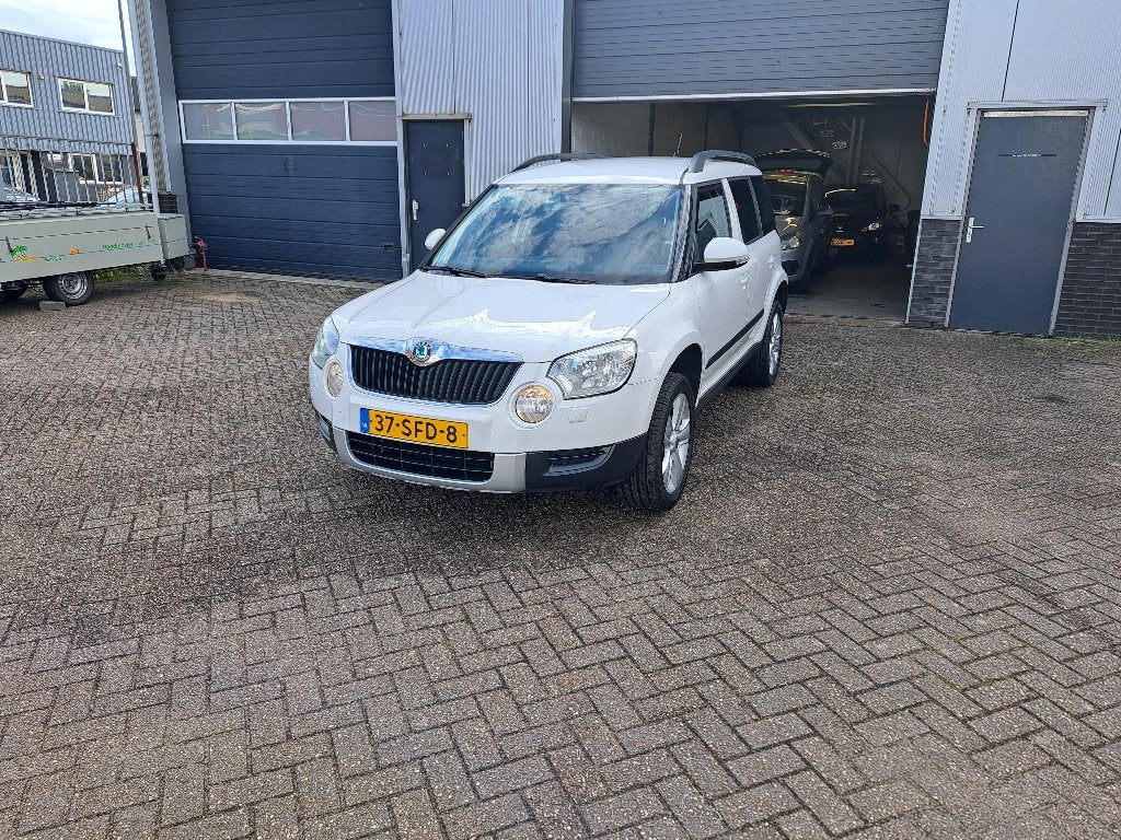 Skoda Yeti 1.2TSI 77KW H6 2011 Wit, Auto's, Voorwielaandrijving, Stof, Zwart, 4 cilinders