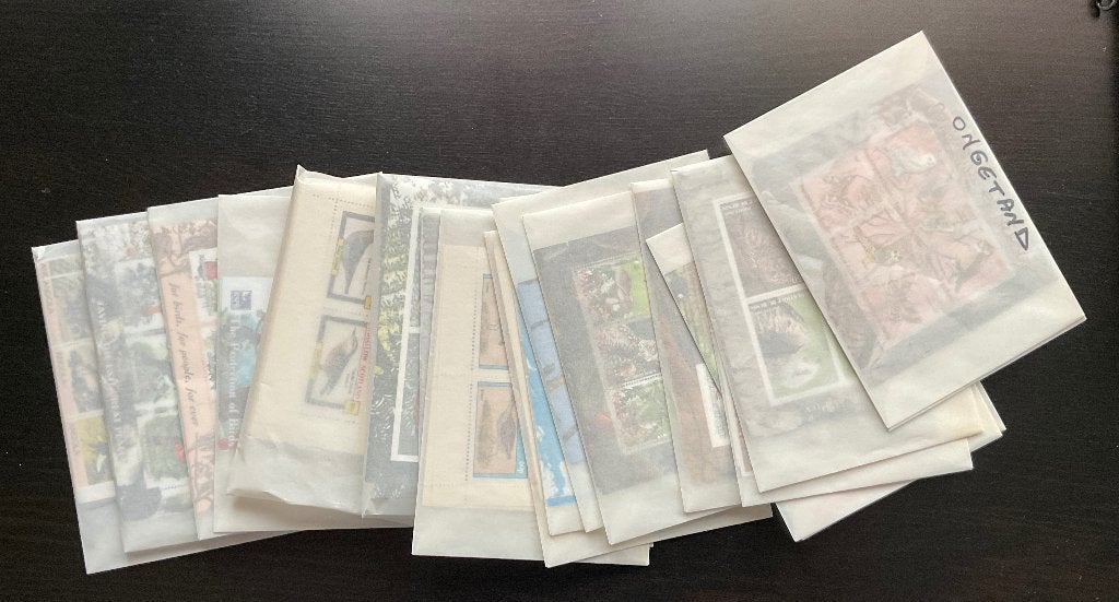 Foto 11 van Grote Stock Postfris Duizenden Thema Postzegelvelletjes
