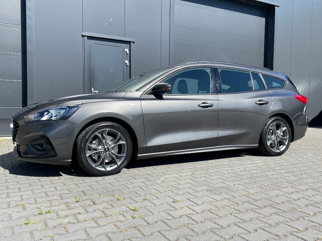 FORD FOCUS WAGON ST-LINE BUSINESS 125PK ECOBOOST AUTOMAAT, Auto's, Ford, Stationwagon, Grijs, Particulier, Sportstoelen