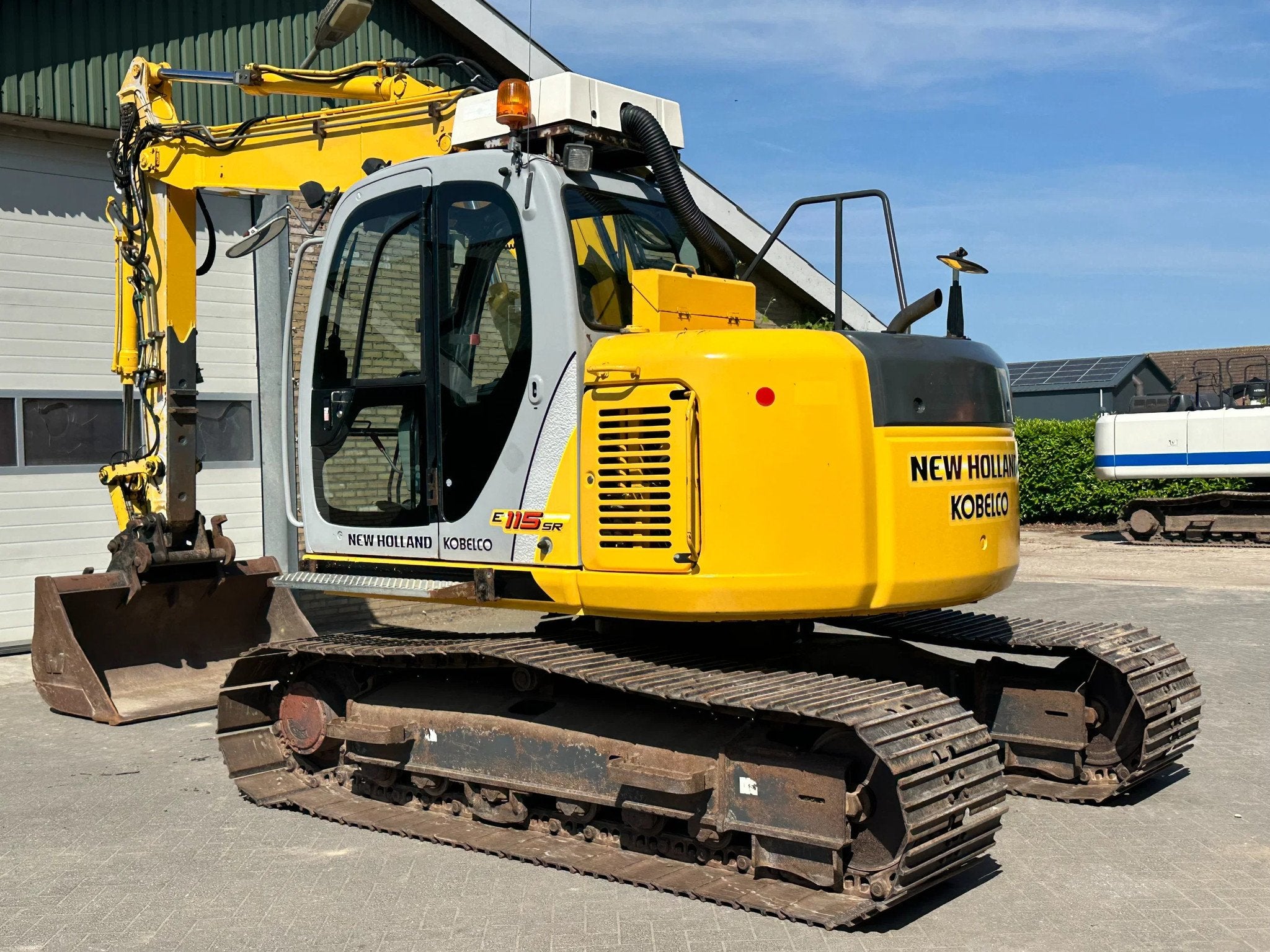 New Holland E115SR-1ES (bj 2005), Zakelijke goederen, Machines en Bouw | Kranen en Graafmachines, Graafmachine