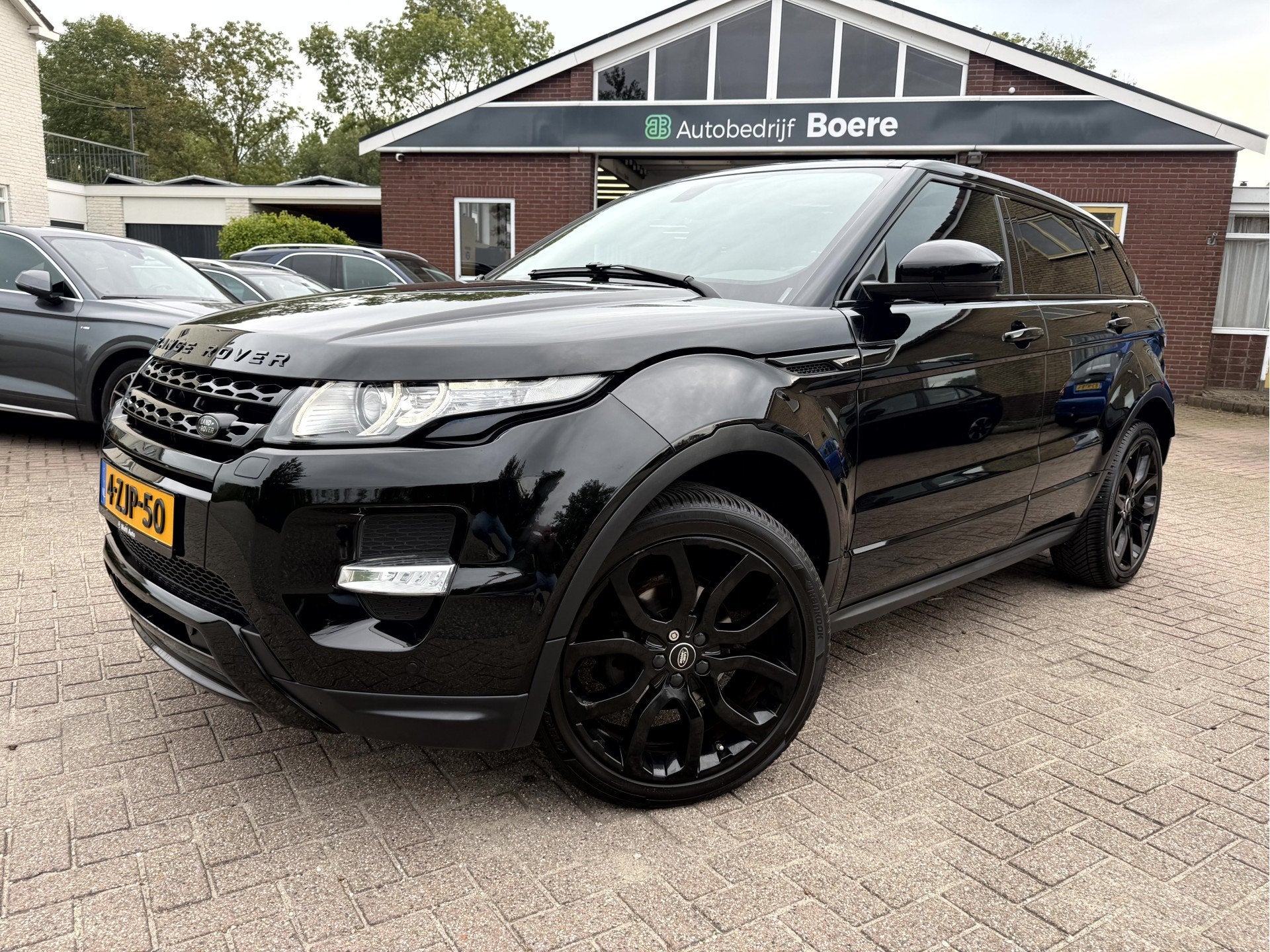 Land Rover Range Rover Evoque 2.0 Si 240pk 4WD Prestige Leer, Euro 5, Zwart, 4 cilinders, Zwart