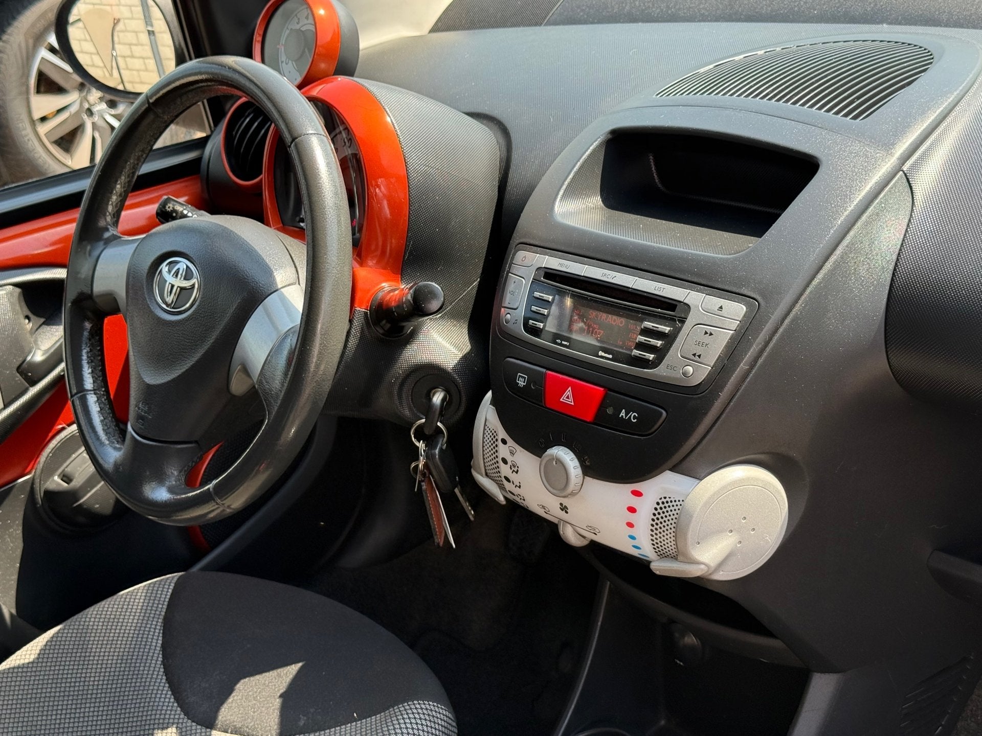 Toyota Aygo 1.0 VVT-i Comfort Orange Airco 5d Elektrische Ra, Voorwielaandrijving, Euro 5, Stof, Gebruikt