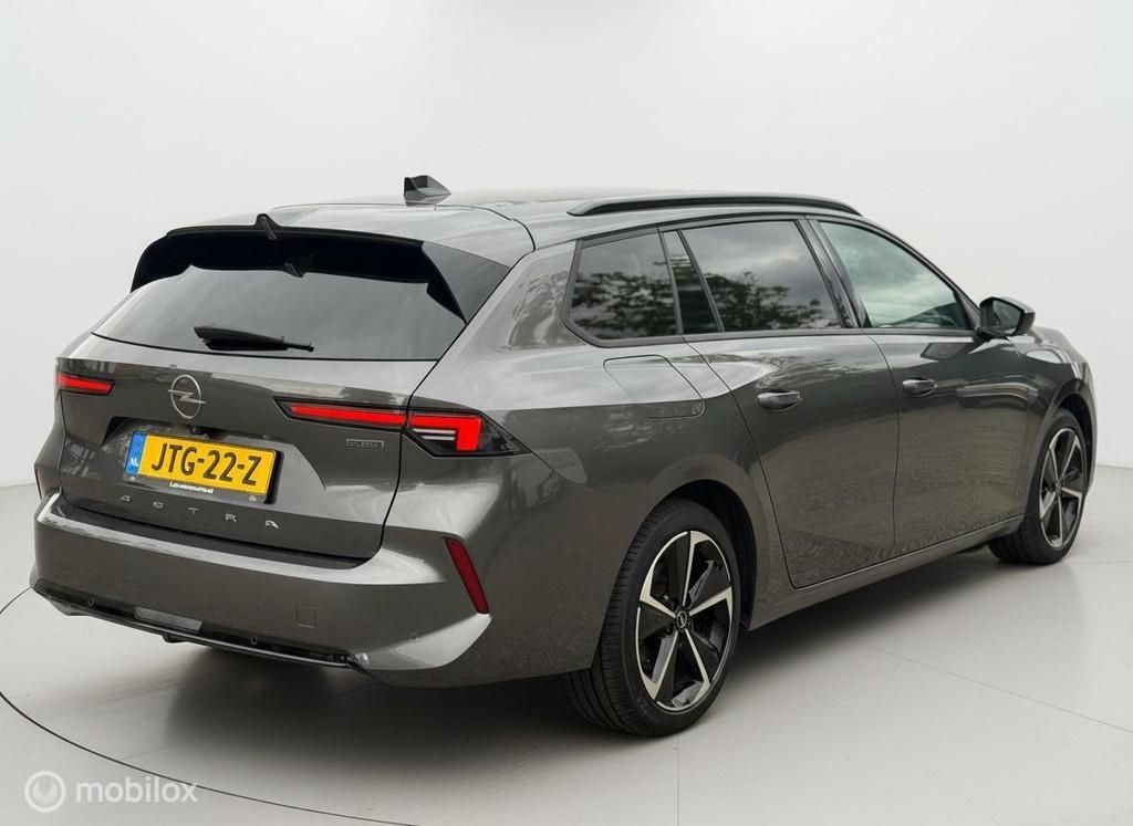 Opel Astra Sports Tourer 1.6 Turbo Plug In Hybrid Edition, Auto's, Stof, Gebruikt, Euro 6, 4 cilinders