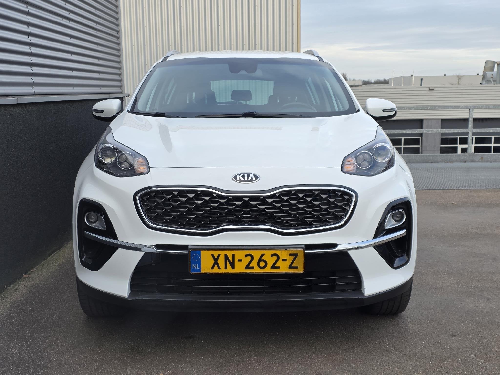 Kia Sportage 1.6 GDI DynamicLine Trekhaak, Nieuw geleverd en, Auto's, Kia, Stof, Gebruikt, 4 cilinders, 1390 kg