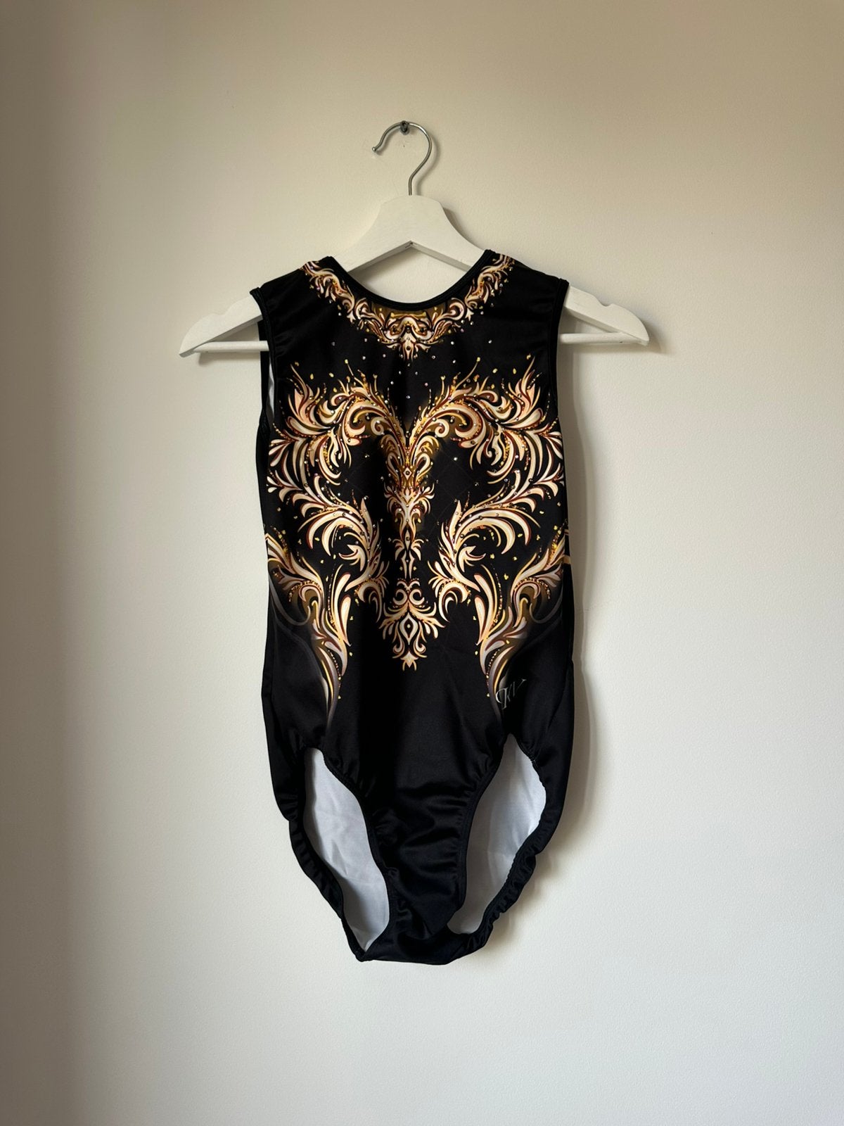 KV leotards, maat AM, nieuwe staat, zwart met goud, Sport en Fitness, Maat 36 t/m 42, Ophalen of Verzenden, Nieuw, Turnpak(je)