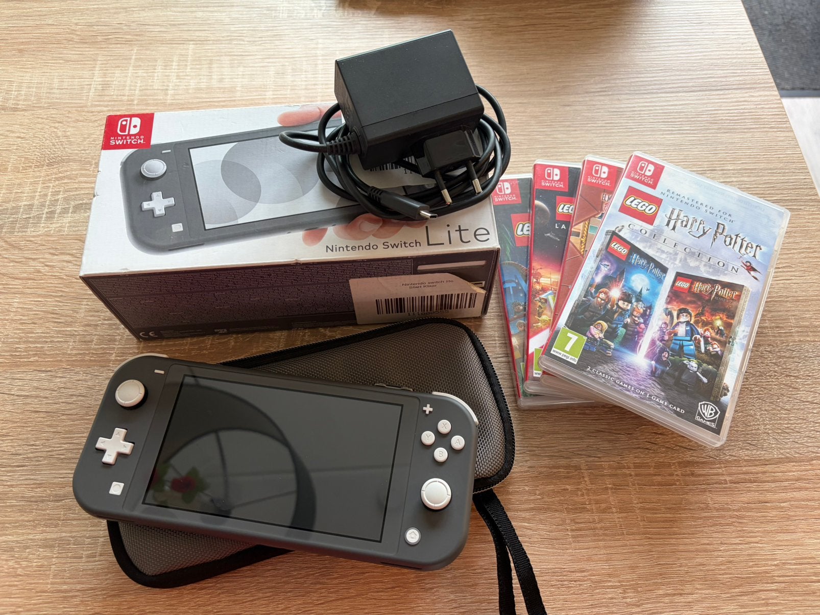 Nintendo Switch Lite grijs izgst met spellen, Spelcomputers en Games, Spelcomputers | Nintendo Switch Lite, Ophalen of Verzenden